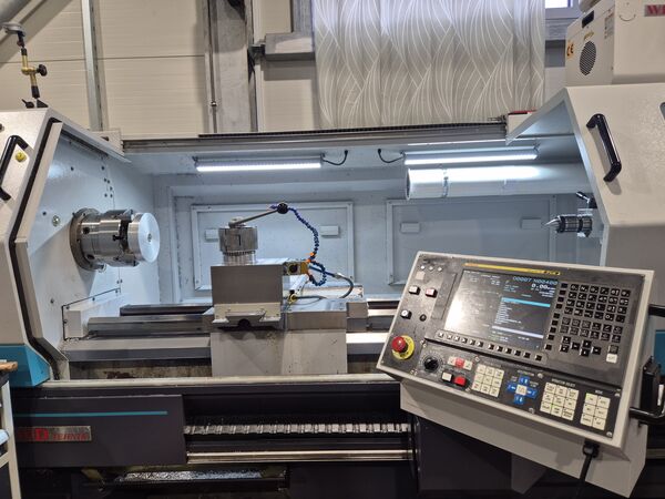 Turning a metal part on a CNC lathe — MIKRO-PRO workshop, Ruše.